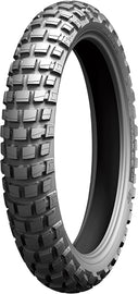 Michelin Anakee Wild front motorcycle tire 90/90-21 bias trail tire with tread pattern, mounted on wheel.