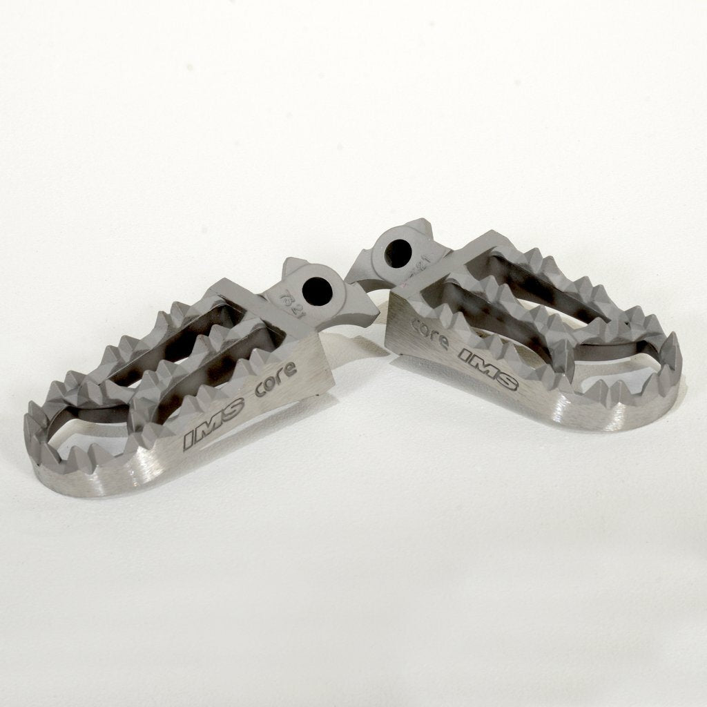 IMS Core Enduro Yamaha footpegs, durable motorcycle foot controls with textured surfaces for grip and stability.