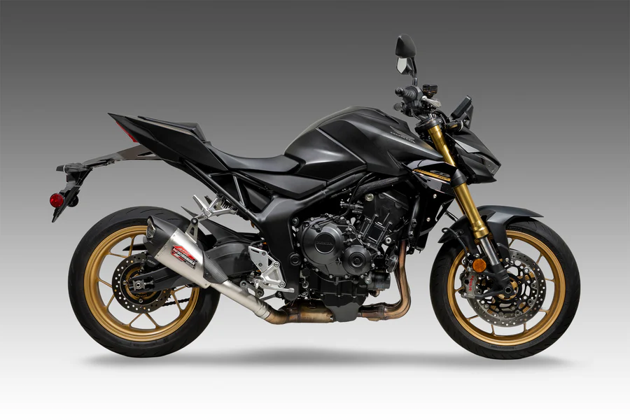 Yoshimura Street At2 slip-on exhaust with stainless steel and carbon fiber end cap, designed for motorcycle performance and style.