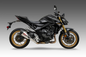 Yoshimura Street At2 slip-on exhaust with stainless steel and carbon fiber end cap, designed for motorcycle performance and style.