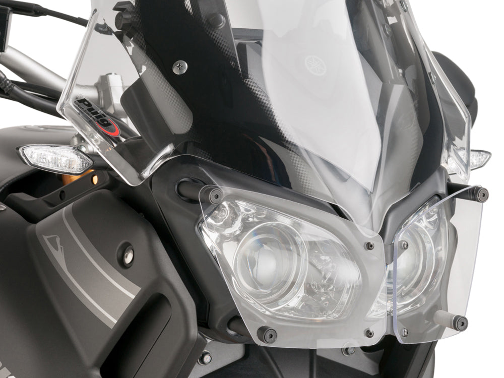 PUIG Headlight Protector 561-08417 installed on motorcycle body, showing durable clear shield for headlight protection.