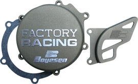 Boyesen Factory Racing Magnesium Ignition Cover showing the sleek silver magnesium finish and detailed branding.