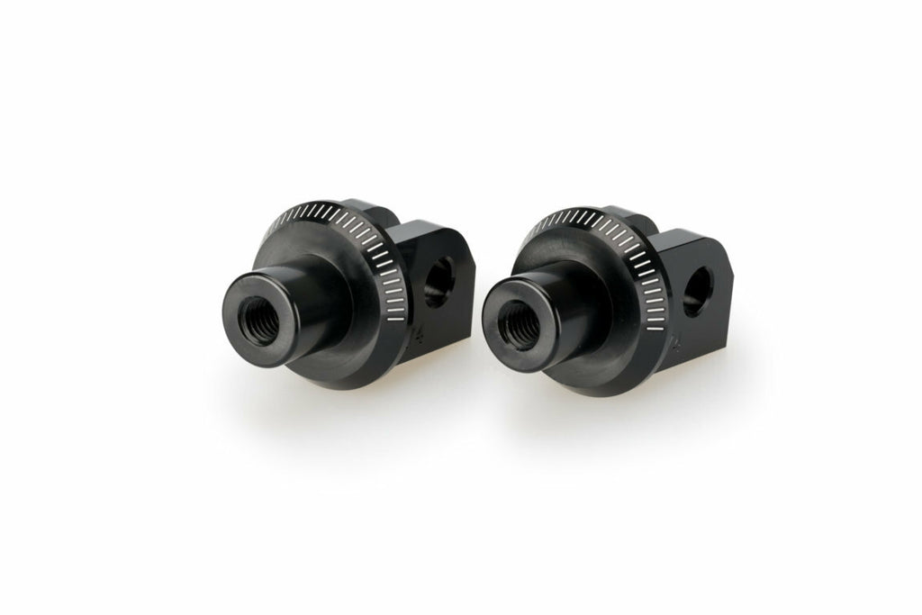 Black PUIG footpeg adapter for Yamaha motorcycle foot controls, shown mounted on motorcycle.