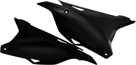 Black Acerbis side panels for motorcycle, featuring sleek design and durable material, with visible mounting points and branding.