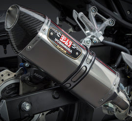Yoshimura R-77 Slip-On Exhaust with stainless steel and carbon fiber end cap, showcasing sleek design and polished finish.