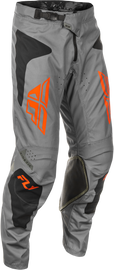 Fly Racing Kinetic Sym motocross pants in grey, orange, and black, size 38, featuring durable fabric and protective design.