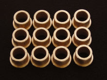 Load image into Gallery viewer, ModQuad bronze A-arm bushing kit with 12 suspension bushings laid out for ATV or motorcycle suspension repair.