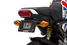 Load image into Gallery viewer, Yoshimura Fender Eliminator Kit for Honda motorcycle, close-up of sleek black body component with mounting hardware