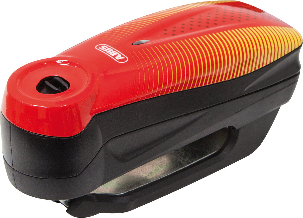 Abus 7000 Rs1 3D Alarm Disc Lock in Sonic Red with key and alert features, used for securing bicycles and motorcycles.
