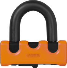Load image into Gallery viewer, Abus Granit Xs67 orange disc lock with key, high-security bike lock, shown in a close-up view.