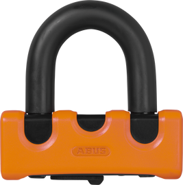 Abus Granit Xs67 orange disc lock with key, high-security bike lock, shown in a close-up view.