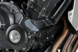 PUIG R19 black frame sliders mounted on a motorcycle body, providing protection and a sleek, aerodynamic look.