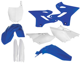Acerbis full plastic kit in black and white, showing various motorcycle fairing panels and components laid out on a white background.