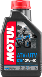 Motul Quad 4T Oil 10W40 1L bottle with label, high-performance motorcycle engine oil from Motul.