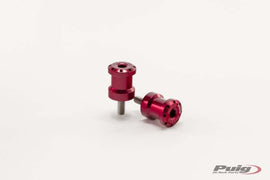Red PUIG Swingarm Spools Hi-Tech 6mm for motorcycle, shown mounted on a bike's swingarm in a close-up view.