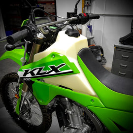 IMS Fuel Tank Natural for Kawasaki KLX300, 3.8-gallon street motorcycle fuel tank with natural finish and secure mounting.