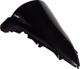 PUIG racing carbon look windscreen for motorcycle, sleek black windshield with aerodynamic design and mounting hardware.