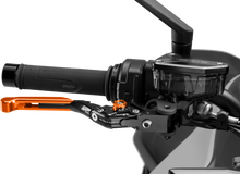 Charger l'image dans la galerie, PUIG Brake Lever 4.0 Fold and Extend in orange for motorcycle, showcasing the ergonomic design and vibrant color.