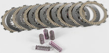 Load image into Gallery viewer, Hinson clutch kit for CRF250R 2010-2016, showing clutch plates and components from Hinson brand on a work surface.