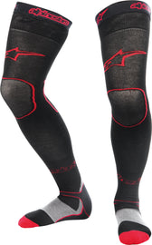 Red Alpine Star motocross socks in large to extra-large size, featuring breathable fabric and cushioned comfort.