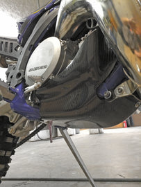 P3 Carbon Fiber Orange Skid Plate with black mounting hardware for off-road vehicle protection.