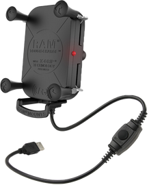 Ram Tough Charge X-Grip wireless charging holder mounted on a vehicle dashboard with a smartphone secured in the bracket.
