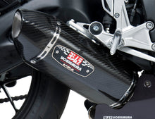 Load image into Gallery viewer, Yoshimura Race R-77 slip-on exhaust with stainless steel and carbon fiber end caps, showcasing sleek design and branding.