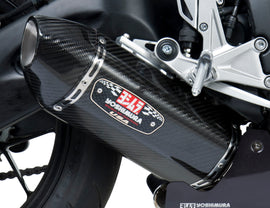 Yoshimura Race R-77 slip-on exhaust with stainless steel and carbon fiber end caps, showcasing sleek design and branding.