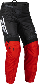 Fly Racing F-16 motorcycle pants in red and black, size 36, featuring reinforced panels and adjustable waist for riding comfort.