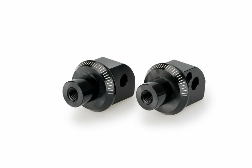 Black PUIG passenger footpeg adapter for Yamaha motorcycles, part number 561-20838BK, attaches to foot controls for rider comfort.