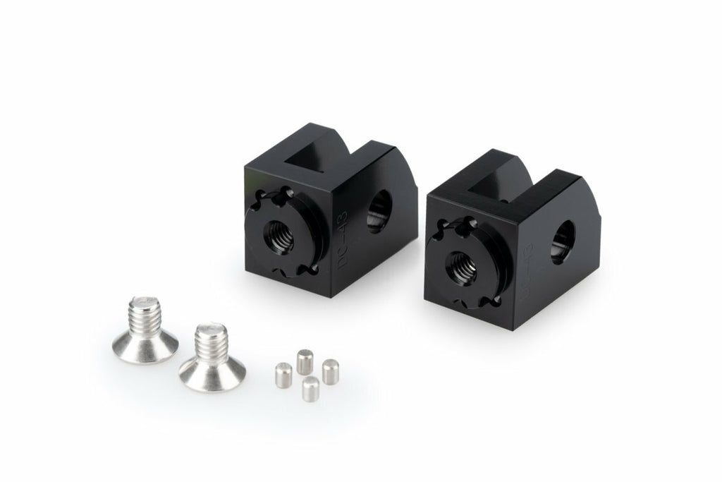 Black PUIG footpeg adaptor for rider foot controls on Yamaha motorcycles, adjustable for custom rider positioning.