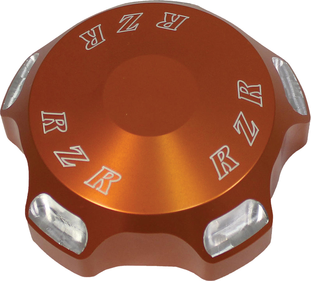 ModQuad Polaris RZR gas cap with orange logo, durable replacement part for RZR off-road vehicles, featuring a sleek design.