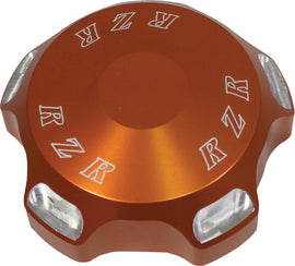 ModQuad Polaris RZR gas cap with orange logo, durable replacement part for RZR off-road vehicles, featuring a sleek design.