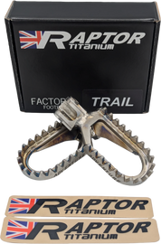 Raptor titanium KTM foot pegs for motorcycle foot controls, durable and lightweight with textured surfaces for grip.