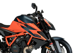 PUIG Downforce side spoilers in black for KTM motorcycle, body kit accessory with aerodynamic design.