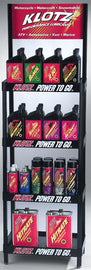 Klotz Oil Accessories display with bottles of Klotz Oil products arranged on a shelf.