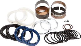 Pivot Works suspension seal and bushing kit for forks, showing various seals and bushings arranged on a white background.