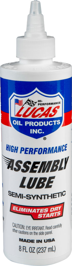 LUCAS Semi-Synthetic Assembly Lube 8 oz bottle for engine assembly, part of a 12-pack, in a clear container with label.