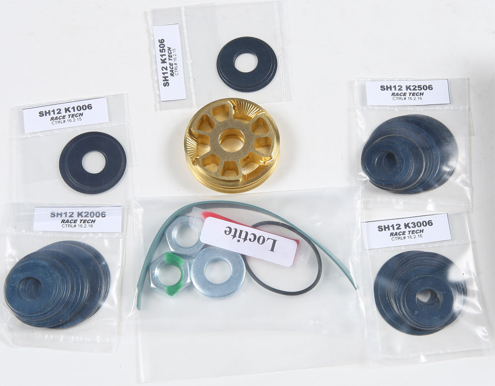 Race Tech Gold Valve shock suspension component with detailed metal parts, designed for motorcycle or vehicle suspension systems.