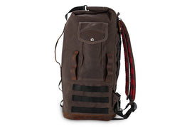 Dark oak Burly Brand sissy bar bag on motorcycle luggage rack, showing durable material and secure straps for motorcycle storage.