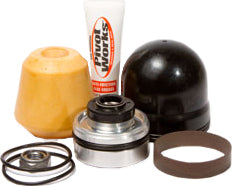 Pivot Works Shock Repair Kit 52-12055 for suspension, showing various seals, o-rings, and components on a clean workspace.