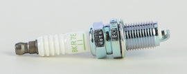 NGK BKR7E-11 spark plug with ceramic insulator and metal threaded shell, designed for automotive engines.