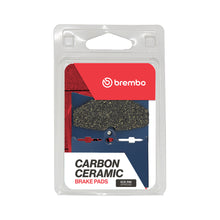 Load image into Gallery viewer, Brembo Prime CC brake pads in carbon ceramic for high-performance braking, with metal backing and detailed branding.