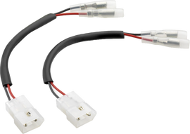 Pair of RIZOMA turn signal cable kits for motorcycle electrical system, with black and red cables and connectors.