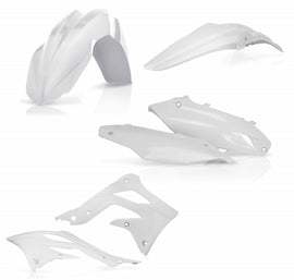 Acerbis white plastic kit for motorcycle or dirt bike with various panels and components displayed on a work surface.