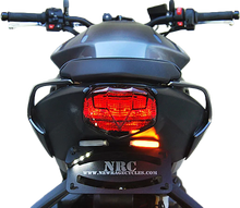 Load image into Gallery viewer, New Rage Cycles Fender Eliminator Tri body kit for motorcycles, shown in black with mounting hardware and sleek design.