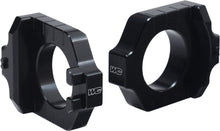 Charger l'image dans la galerie, WORKS Axle Blocks Elite Kaw/Suz Black drive component with black finish, designed for motorcycle axle stabilization.