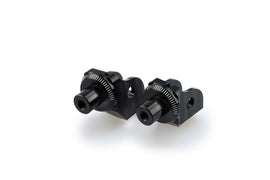 PUIG Footpeg Adapter 561-07246BK for motorcycle foot controls, black metal with mounting hardware visible.