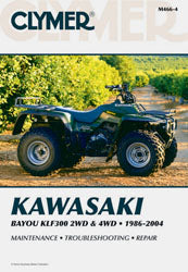 Clymer repair manual for Kawasaki KLF300 ATV, showing detailed illustrations and troubleshooting tips inside the tools book