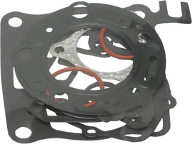 Cometic Top End Gasket Kit 54mm HON engine with gaskets and seals laid out on a surface, detailed close-up of gasket components.